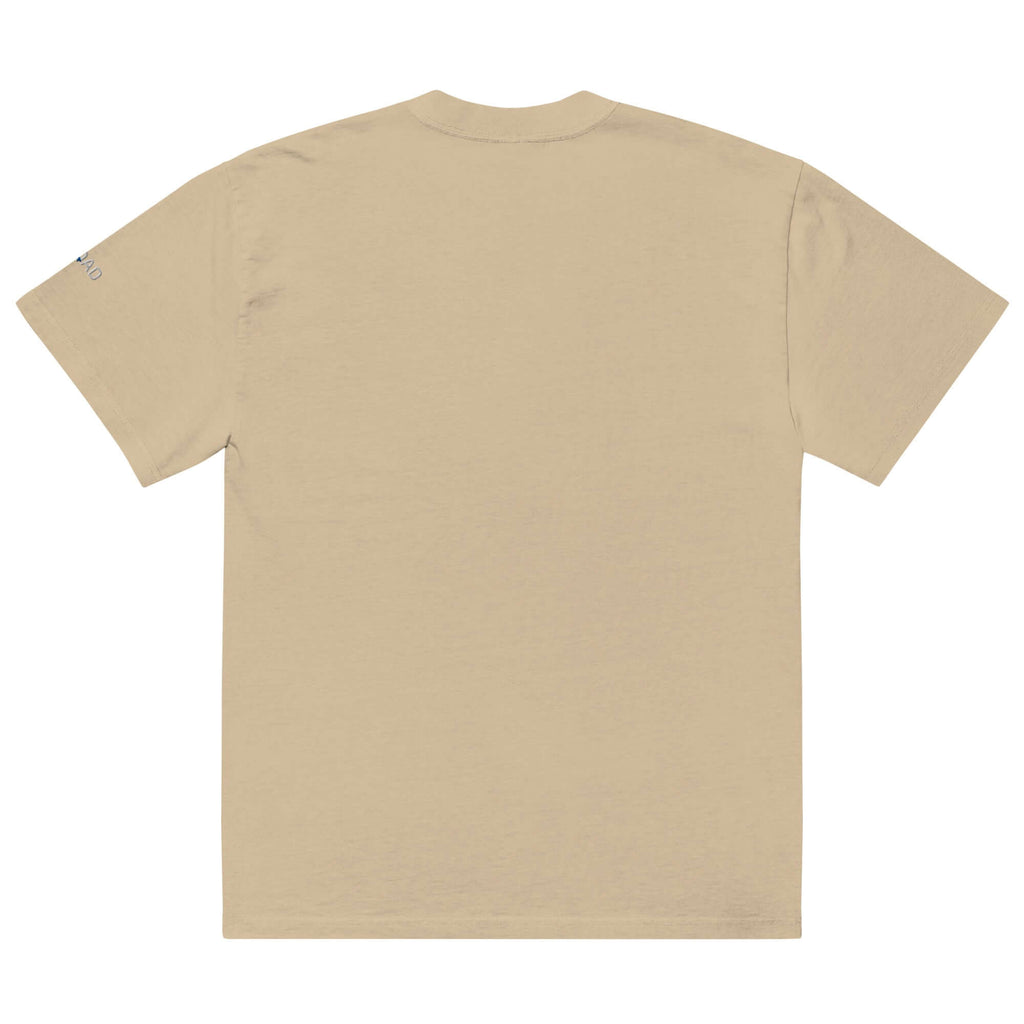 Back view of oversized faded t shirt in beige, showcasing a relaxed fit and vintage aesthetic.