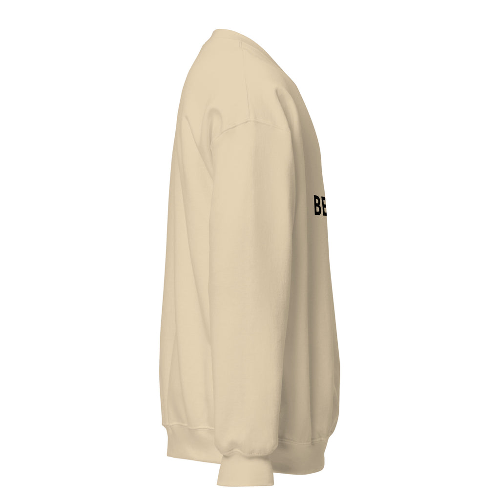 premium sweatshirt women in sand color with 'BE KIND' text on front, part of the Kindness Collection.